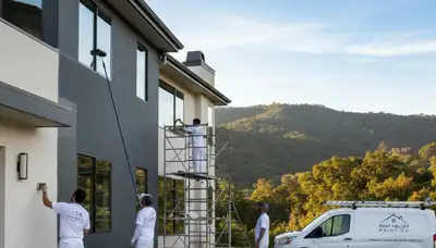 Professional house painters working on residential exterior in Mountain View, CA