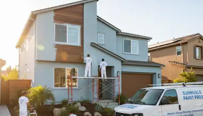 Professional house painters in Mountain View CA finishing an exterior home repaint